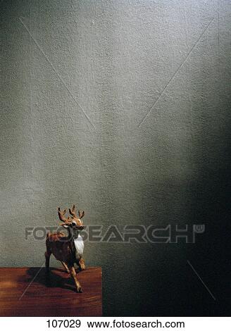 Stock Photo - Miniature reindeer on night stand. Fotosearch