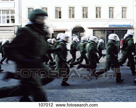 Riot police running in street View Large Photo Image Stock Image - Riot police running in street. Fotosearch