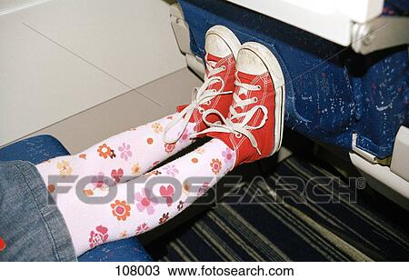 Child’s feet against airplane seat View Large Photo Image Stock Image - Child’s feet against airplane seat. Fotosearch