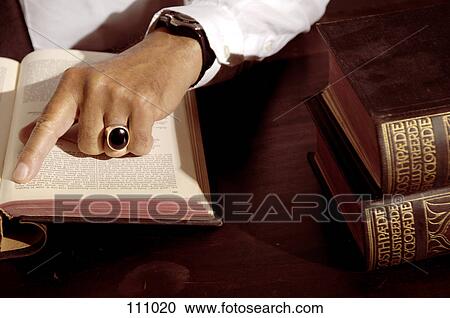 Close-up of man reading a book View Large Photo Image Stock Image - Close-up of man reading a book. Fotosearch
