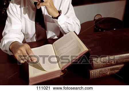 Man reading a book View Large Photo Image Stock Image - Man reading a book. Fotosearch