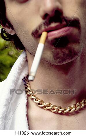 Man smoking a cigarette View Large Photo Image Stock Photography - Man smoking a cigarette. Fotosearch