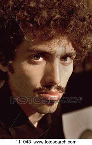 Portrait of man with curly hair View Large Photo Image Stock Image - Portrait of man with curly hair. Fotosearch
