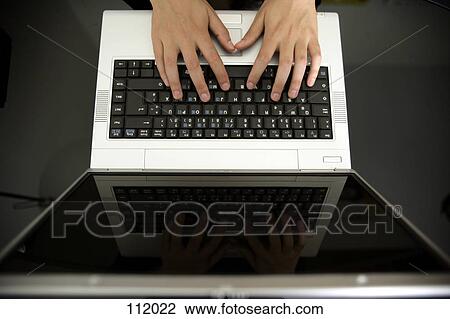 Woman typing on laptop keyboard View Large Photo Image Stock Image - Woman typing on laptop keyboard. Fotosearch