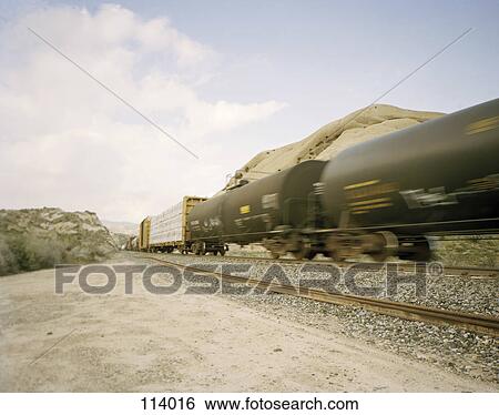 Freight train in motion View Large Photo Image Stock Photograph - Freight train in motion. Fotosearch