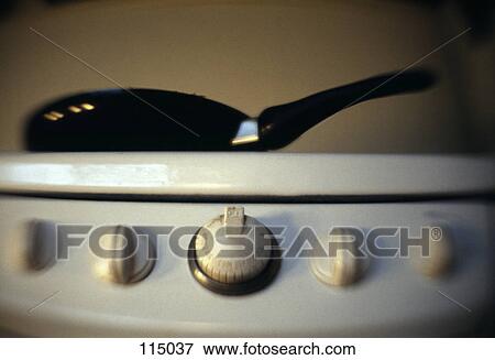 Stock Photo - Frying pan on stove. Fotosearch