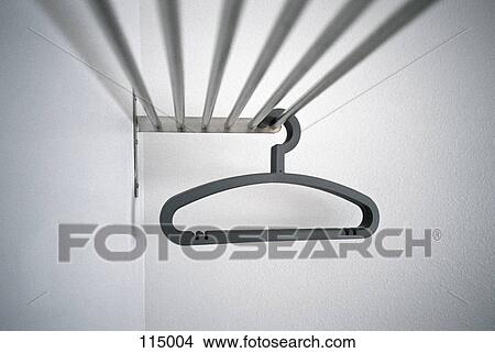 Hangers on clothes rack View Large Photo Image Picture - Hangers on clothes rack. Fotosearch