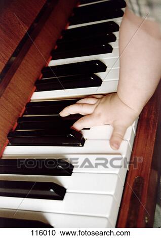 Child’s hand on piano keys View Large Photo Image Stock Image - Child’s hand on piano keys. Fotosearch