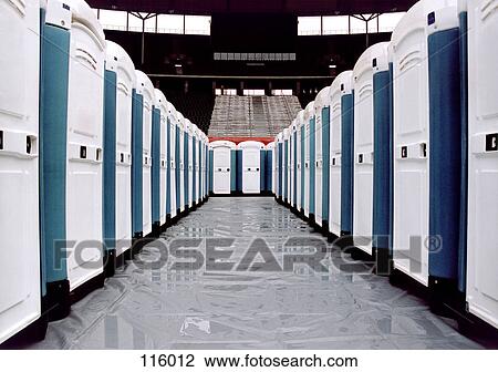 Stock Image - Portable restrooms in a stadium. Fotosearch