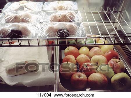 Fruit and snacks in a refrigerator View Large Photo Image Picture - Fruit and snacks in a refrigerator. Fotosearch