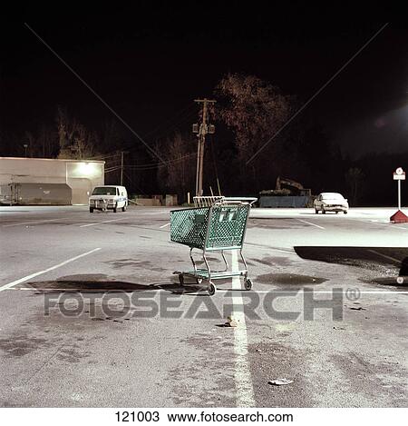 Abandoned shopping cart in parking lot View Large Photo Image Stock Image - Abandoned shopping cart in parking lot. Fotosearch