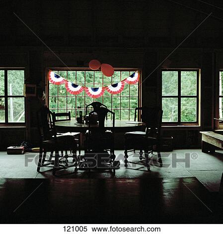 Party decorations hanging in dining room View Large Photo Image Stock Photography - Party decorations hanging in dining room. Fotosearch