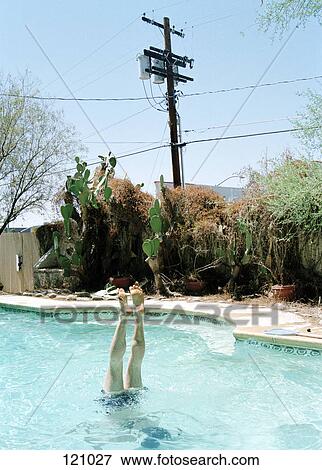 Person diving into swimming pool View Large Photo Image Stock Photo - Person diving into swimming pool. Fotosearch