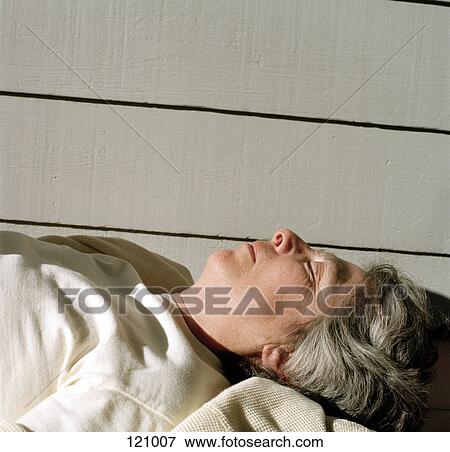 Woman lying down on back View Large Photo Image Stock Photo - Woman lying down on back. Fotosearch