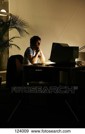 Man looking at computer monitor View Large Photo Image Stock Photo - Man looking at computer monitor. Fotosearch