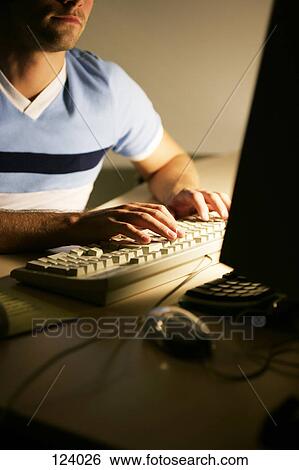 Stock Photograph - Man typing on computer keyboard. Fotosearch