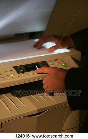 Man using a photocopier View Large Photo Image Stock Photograph - Man using a photocopier. Fotosearch