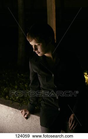 Stock Photo - Portrait of woman wearing a black suit. Fotosearch