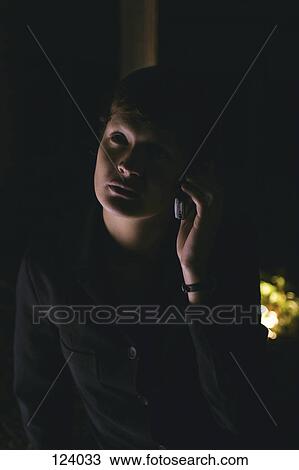 Woman listening to cell phone View Large Photo Image Stock Image - Woman listening to cell phone. Fotosearch