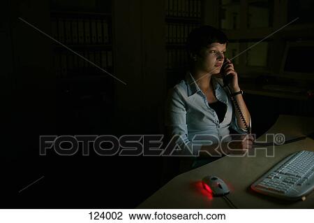 Woman on telephone, sitting at desk View Large Photo Image Stock Image - Woman on telephone, sitting at desk. Fotosearch