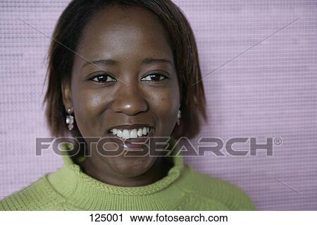 Portrait of woman wearing a green sweater View Large Photo Image Stock Image - Portrait of woman wearing a green sweater. Fotosearch