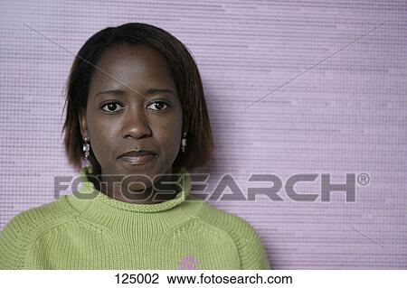 Portrait of woman wearing a green sweater View Large Photo Image Stock Image - Portrait of woman wearing a green sweater. Fotosearch