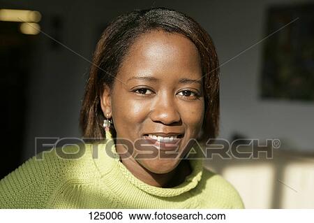Portrait of woman wearing a green sweater View Large Photo Image Stock Photograph - Portrait of woman wearing a green sweater. Fotosearch