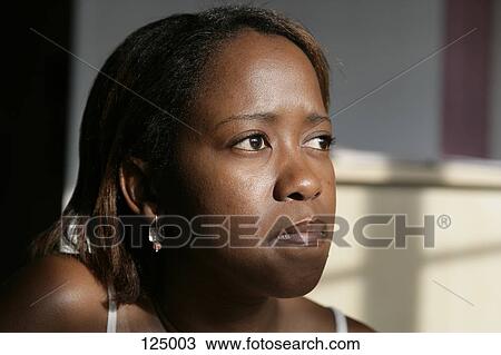 Portrait of woman wearing a tank top View Large Photo Image Stock Image - Portrait of woman wearing a tank top. Fotosearch