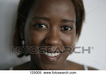 Portrait of woman wearing a tank top View Large Photo Image Stock Photography - Portrait of woman wearing a tank top. Fotosearch