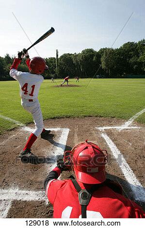 A baseball player at bat View Large Photo Image Stock Photo - A baseball player at bat. Fotosearch