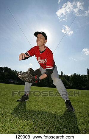 An outfielder preparing to catch a ball View Large Photo Image Stock Photo - An outfielder preparing to catch a ball. Fotosearch
