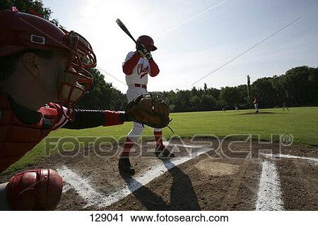 Stock Image - Baseball batter and catcher at home plate. Fotosearch