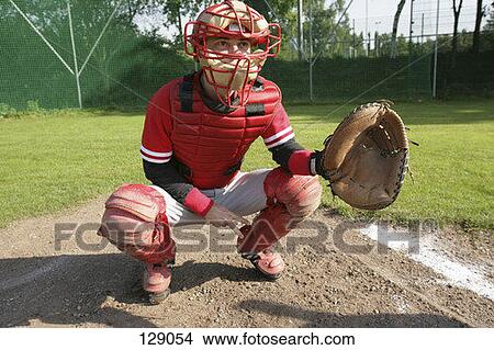 Baseball catcher making a hand signal View Large Photo Image Picture - Baseball catcher making a hand signal. Fotosearch