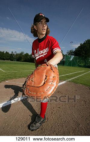 Baseball player standing in the field View Large Photo Image Stock Image - Baseball player standing in the field. Fotosearch