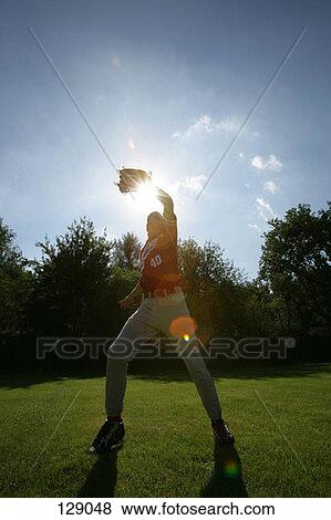 Stock Photo - Outfielder catching a baseball. Fotosearch