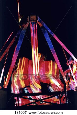 Amusement park ride in motion View Large Photo Image Stock Photo - Amusement park ride in motion. Fotosearch