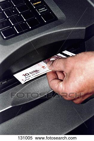 Close-up of a hand taking money from an ATM View Large Photo Image Stock Photography - Close-up of a hand taking money from an ATM. Fotosearch