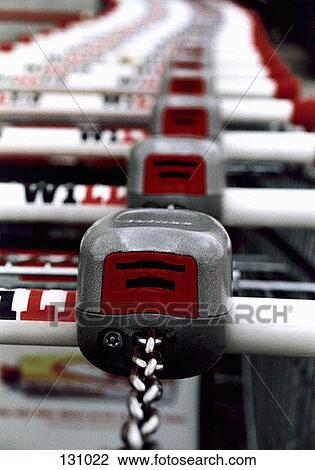 Shopping carts in a row View Large Photo Image Stock Image - Shopping carts in a row. Fotosearch
