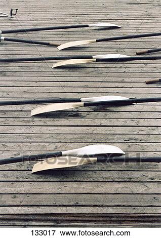 A row of oars on a dock View Large Photo Image Stock Photo - A row of oars on a dock. Fotosearch