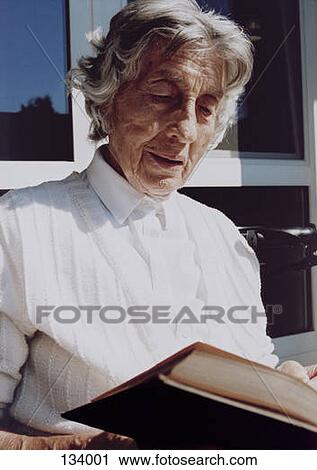 Senior woman reading a book View Large Photo Image Stock Image - Senior woman reading a book. Fotosearch