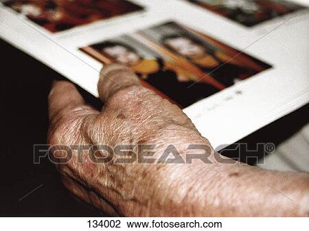 Senior woman with photo album View Large Photo Image Stock Image - Senior woman with photo album. Fotosearch