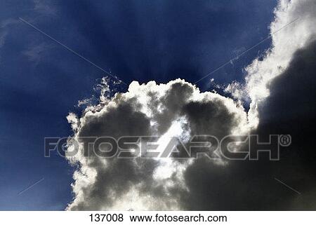 Sunlight behind cloudscape View Large Photo Image Stock Photo - Sunlight behind cloudscape. Fotosearch