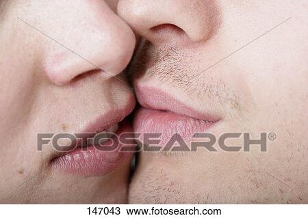 A man and woman kissing View Large Photo Image Stock Image - A man and woman kissing. Fotosearch