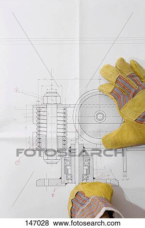 Gloved hands on a diagram View Large Photo Image Stock Photo - Gloved hands on a diagram. Fotosearch