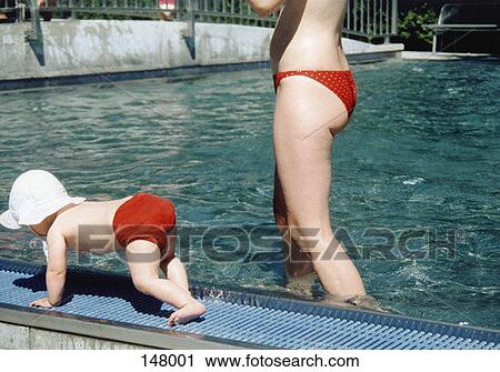 A toddler crawling near the edge of a baby swimming pool View Large Photo Image Stock Image - A toddler crawling near the edge of a baby swimming pool. Fotosearch