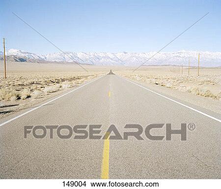 A long road in a remote area View Large Photo Image Picture - A long road in a remote area. Fotosearch