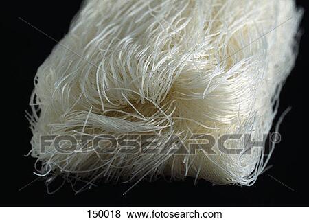 Close up of noodles on a black surface View Large Photo Image Stock Photo - Close up of noodles on a black surface. Fotosearch