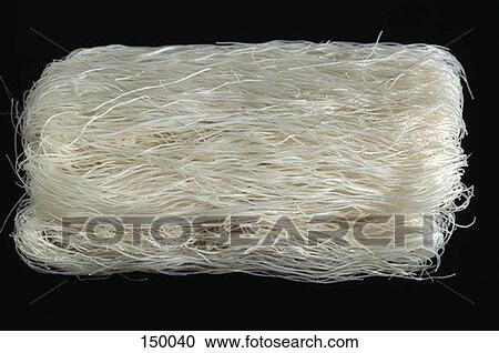 Close up of raw noodles on a black surface View Large Photo Image Stock Image - Close up of raw noodles on a black surface. Fotosearch