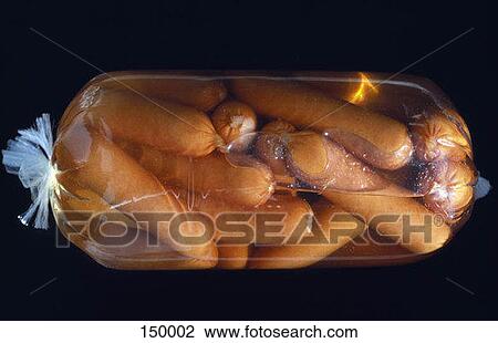 Stock Image - Close up of sausages in plastic. Fotosearch
