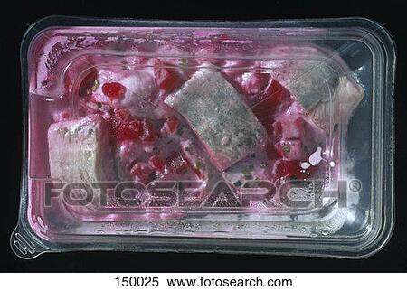 Pieces of fish in a sauce with beets in a plastic container View Large Photo Image Stock Photography - Pieces of fish in a sauce with beets in a plastic container. Fotosearch